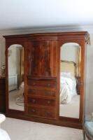 A fine Edwardian mahogany, tulipwood and satinwood triple wardrobe