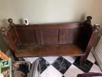 An 18th century oak hall seat / pew