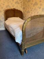A Louis XVI style giltwood single bed