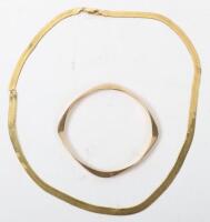 A 9ct gold bangle, with a 9ct gold necklace