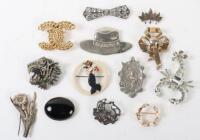 A selection of Art Deco and later brooches, including Chanel