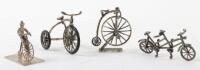 Three 925 silver bikes including a tandem, tricycle and penny farthing on stand, with another penny farthing on base