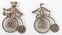 Two silver cycling penny farthing brooches, one with teddy bear, Birmingham 1991, and another stamped 925