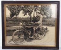 A large original photograph of a gentleman on an Indian motorcycle