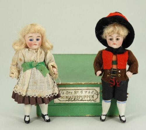 A pair of miniature all bisque dolls in original box, German circa 1900,