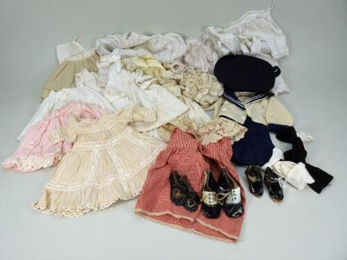 Collection of various dolls dresses and shoes,