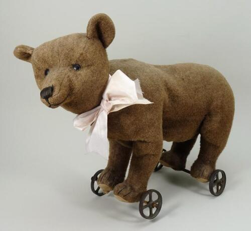 Early pre-button Steiff soft toy bear on wheels, German circa 1895,