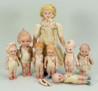 Collection of seven English all- bisque novelty dolls, 1915-20,