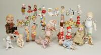 Collection of all-bisque German novelty dolls and ornaments, i