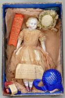 Parian-type bisque shoulder head doll in original box with provenance, German circa 1865,