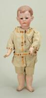 A Good Kammer & Reinhardt 115 ‘Phillip’ bisque head character doll, German circa 1910,