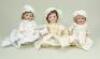 An A.M 323 Googly-eyed bisque head doll and two baby dolls, German circa 1920s,