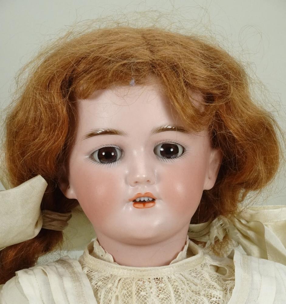 A Simon & Halbig 1248 'Santa' bisque head doll, German circa 1910 A Simon & Halbig 1248 'Santa' bisque head doll, German circa 1910