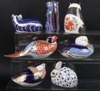 A collection of Royal Crown Derby Imari paperweights