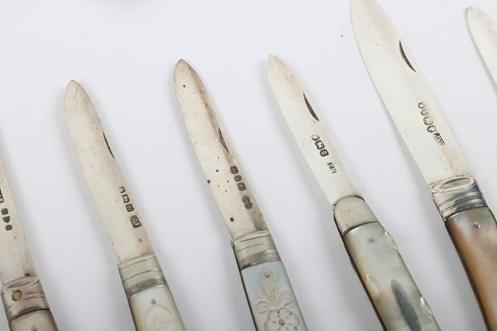 Twenty Victorian silver and mother of pearl folding fruit knives