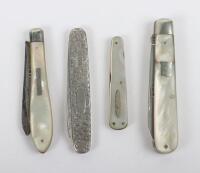 Four Victorian silver and mother of pearl combination and travelling knives