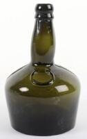 An early 19th century green glass onion bottle
