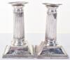 A pair of Victorian squat Corinthian column candlesticks, by William Hutton, London 1881 - 4