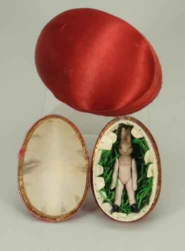 A Hertwig all-bisque rabbit in egg, circa 1910,