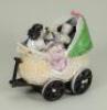 Victorian porcelain pram box with baby and child holding a doll,