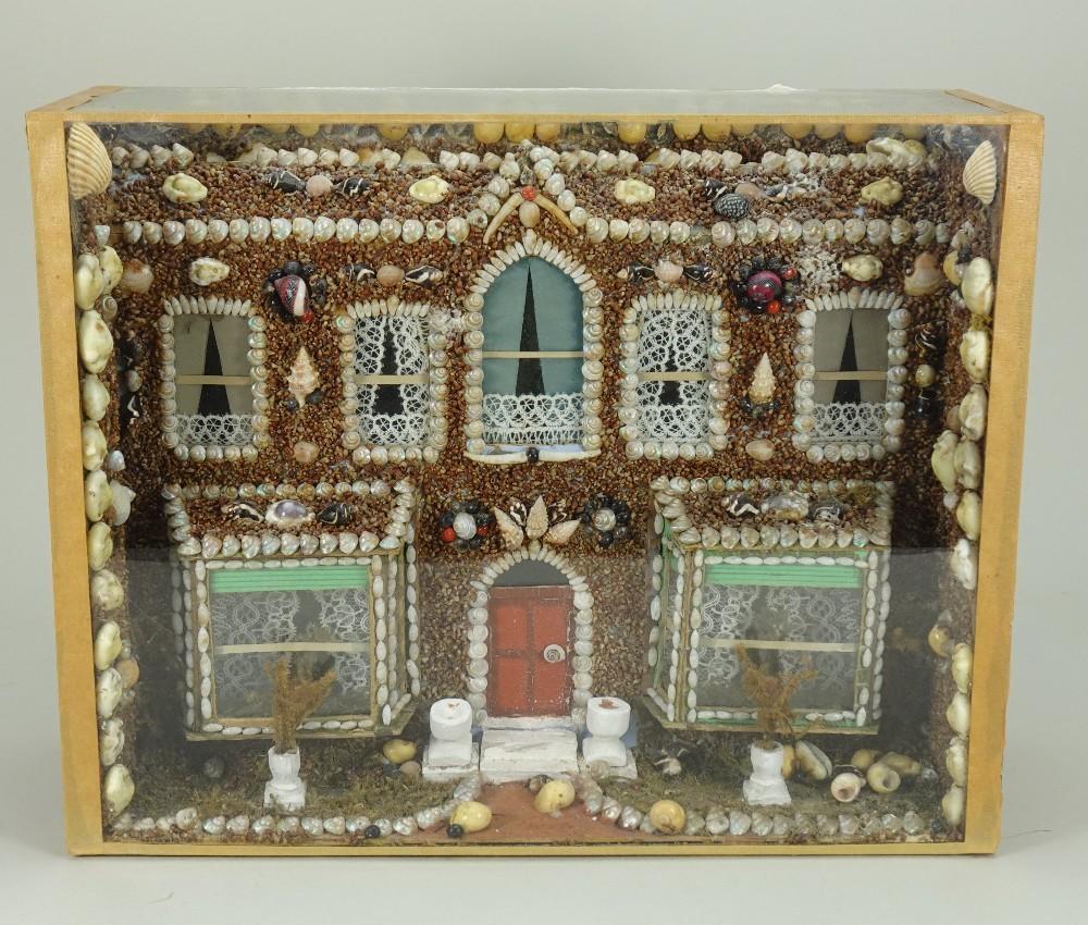 Shell Castle Style A Victorian cased shell model of a seaside Villa,