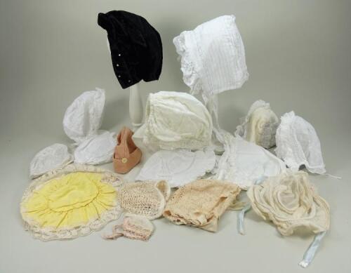 A collection of dolls bonnets,