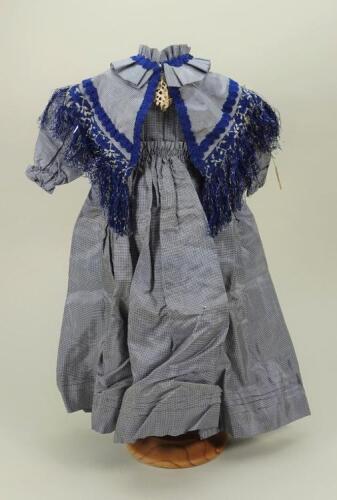 A larger blue silk check dress,