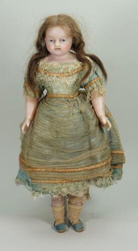 A good all original Montanari poured wax shoulder head doll, English circa 1860,