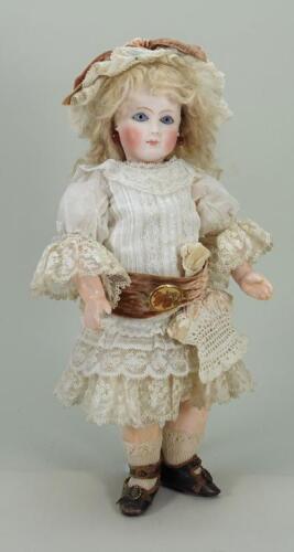 Rare and interesting early bisque head mystery Bebe doll for &lsquo;AU NAIN BLEU&rsquo; of Paris, French circa 1880,