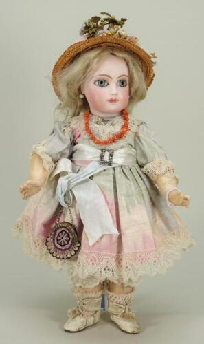A good and early Almond eyed Portrait Jumeau bisque head Bebe doll, French circa 1880,