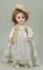 A Jumeau bisque head Bebe doll marked R.R, French 1890s,