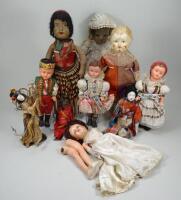 A group of various dolls,