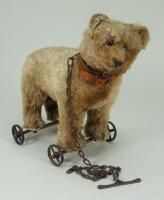 Brown mohair bear on wheels, probably Steiff, circa 1909,