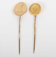 Two gold stick pins including a Peru 1911 1/5 Libra coin (.917) mounted on pin and a 9ct gold heraldic badge on pin