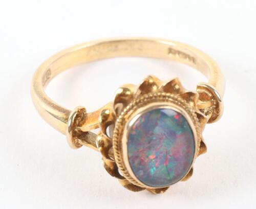 A 9ct gold black opal ring