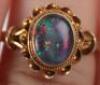 A 9ct gold black opal ring - 6