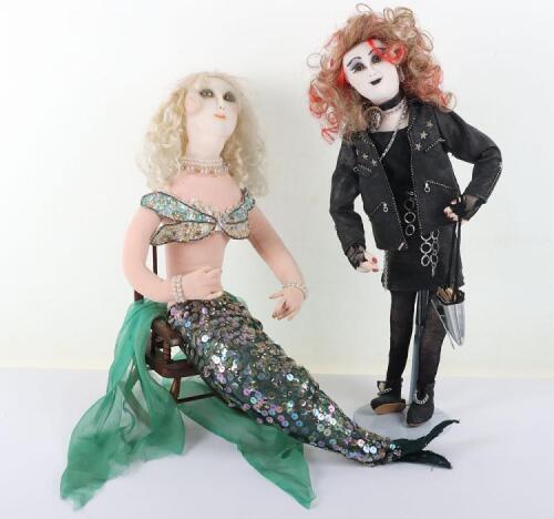 Two character dolls by Rosemary Bradshaw of a punk rock ÔchickÕ and a mermaid seated in wood chair