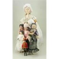 Collection of seven carved wooden peg dolls,
