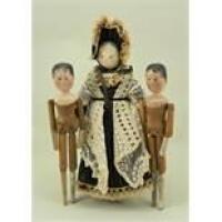 Three painted wooden peg dolls, 1920s,