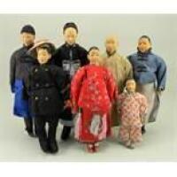 Collection of seven Door of Hope carved wooden missionary dolls,