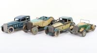 Four English tinplate clockwork toy cars, 1930/50s