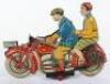 A rare and large George Levy Gely tinplate clockwork Motorbike with Lady pillion passenger, German 1930 - 7