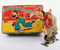 T.P.S (Japan) tinplate Clown on Roller Skates clockwork toy, 1950s