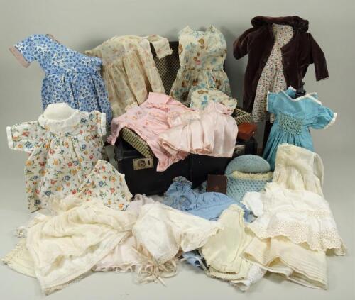 A dolls trunk and clothes, English 1930s,