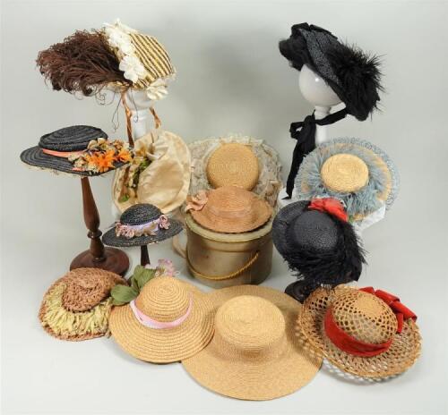 Collection of various straw and silk dolls bonnets,