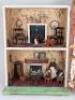 A Silber & Fleming painted wooden dolls house and contents, circa 1890, - 2