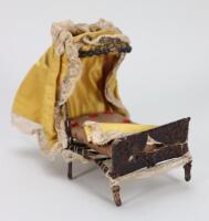 A rare mid-nineteenth century Ragged School Dolls House Bed with original canopy,