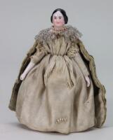 A miniature glazed china shoulder head doll on jointed wooden body, German mid 19th century,