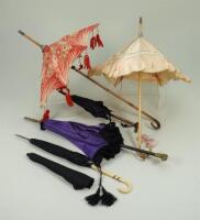 Five dolls parasols and umbrellas,