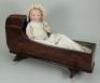 Armand Marseille mould 341 bisque head Dream Baby and mahogany cradle, German circa 1920,